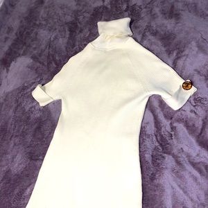 Super cute turtle neck sweater dress with button detail on the sleeves.  XS